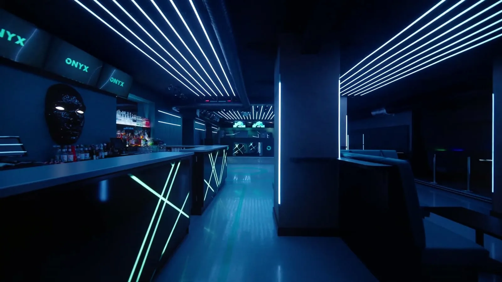 The ONYX bar with the wordmark on three screens and a black mask on the wall