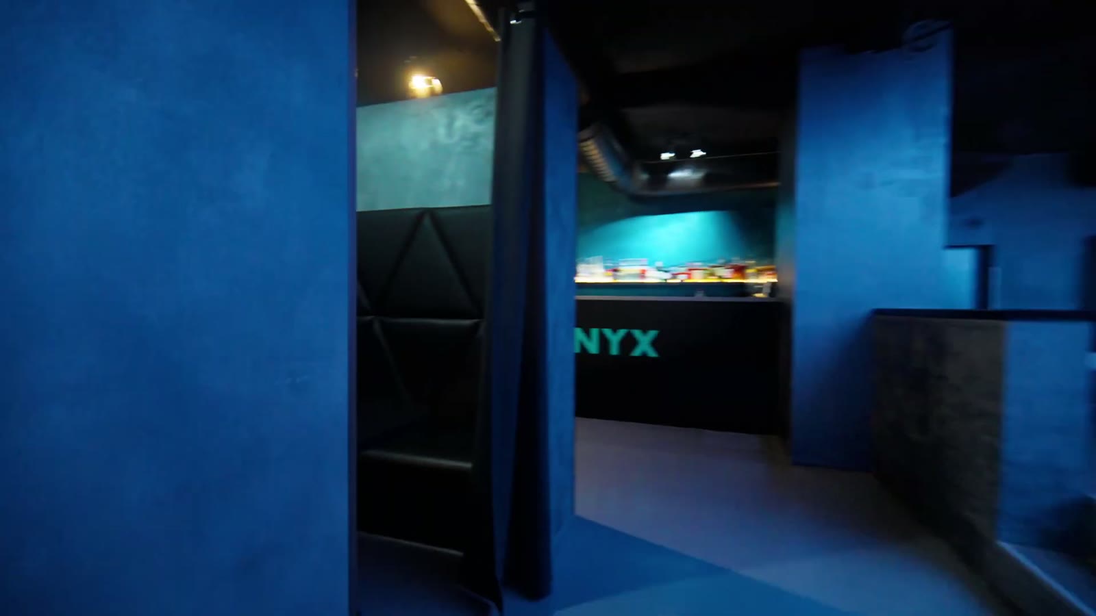 Blue corridor leading into the ONYX bar